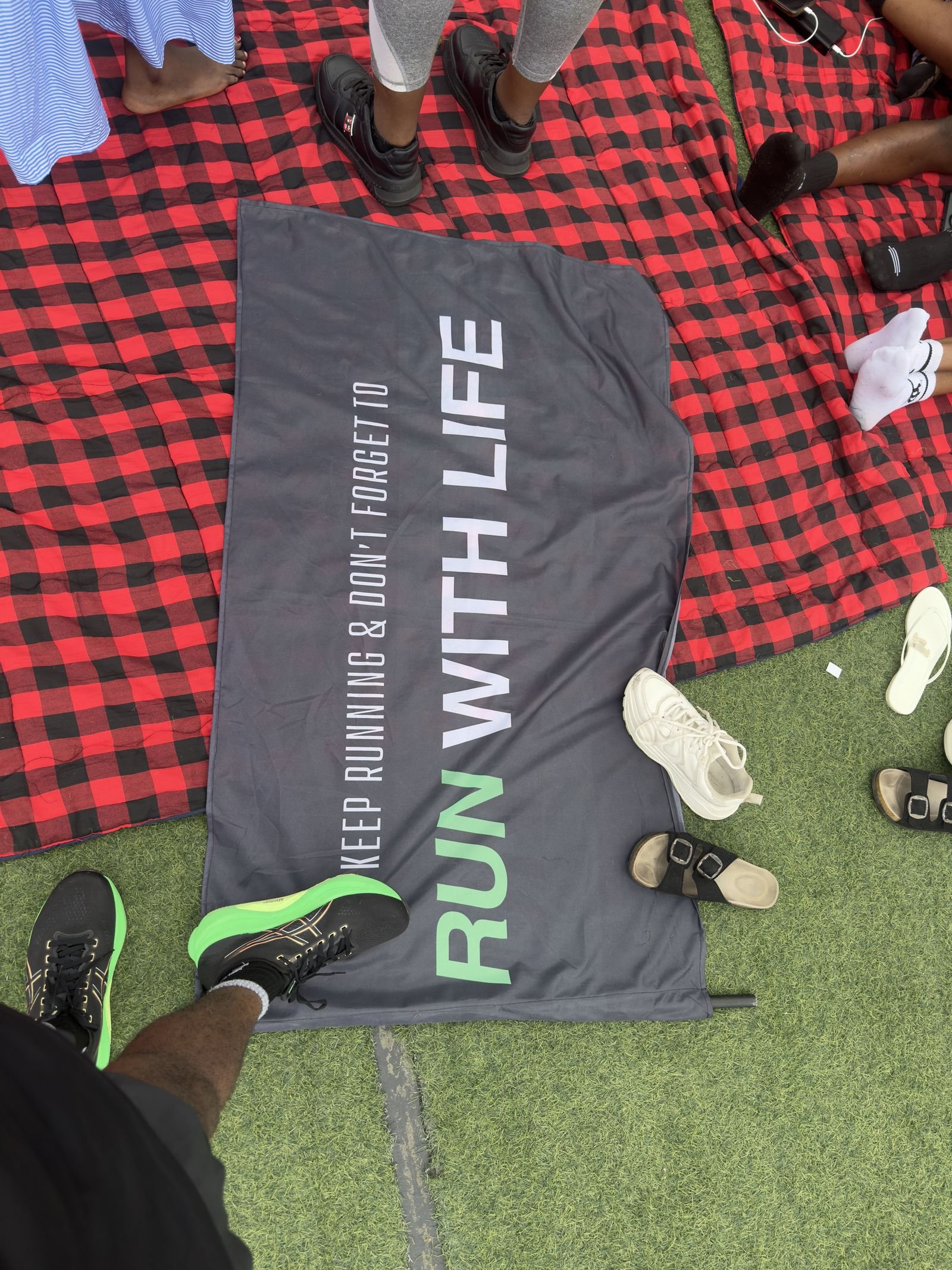 A Life Runner holding a Run With Life flag